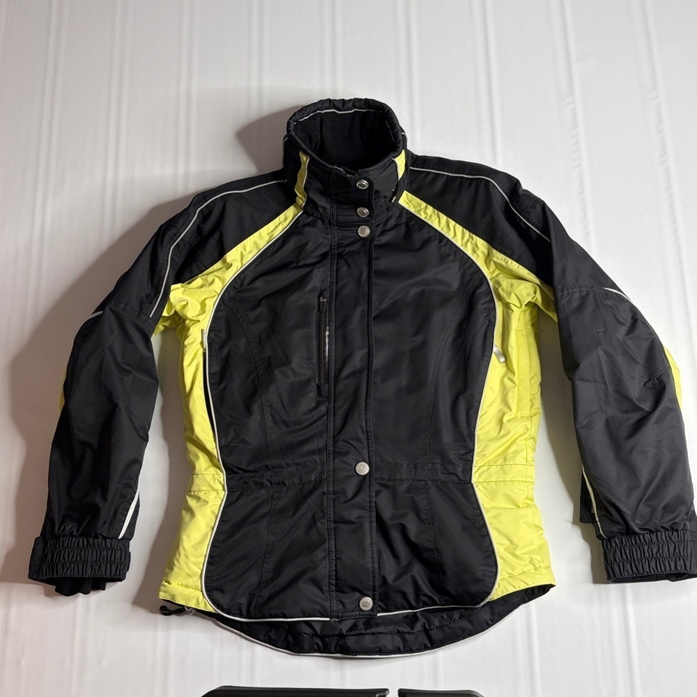 Obermeyer Ridgeline Weather X System women's ski jacket in black & neon yellow.
